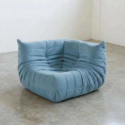 Bruma Sofa Corner in light blue velvet suede photographed from the front angle.