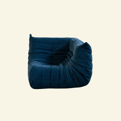 Bruma Sofa Corner in dark blue velvet suede on a beige background