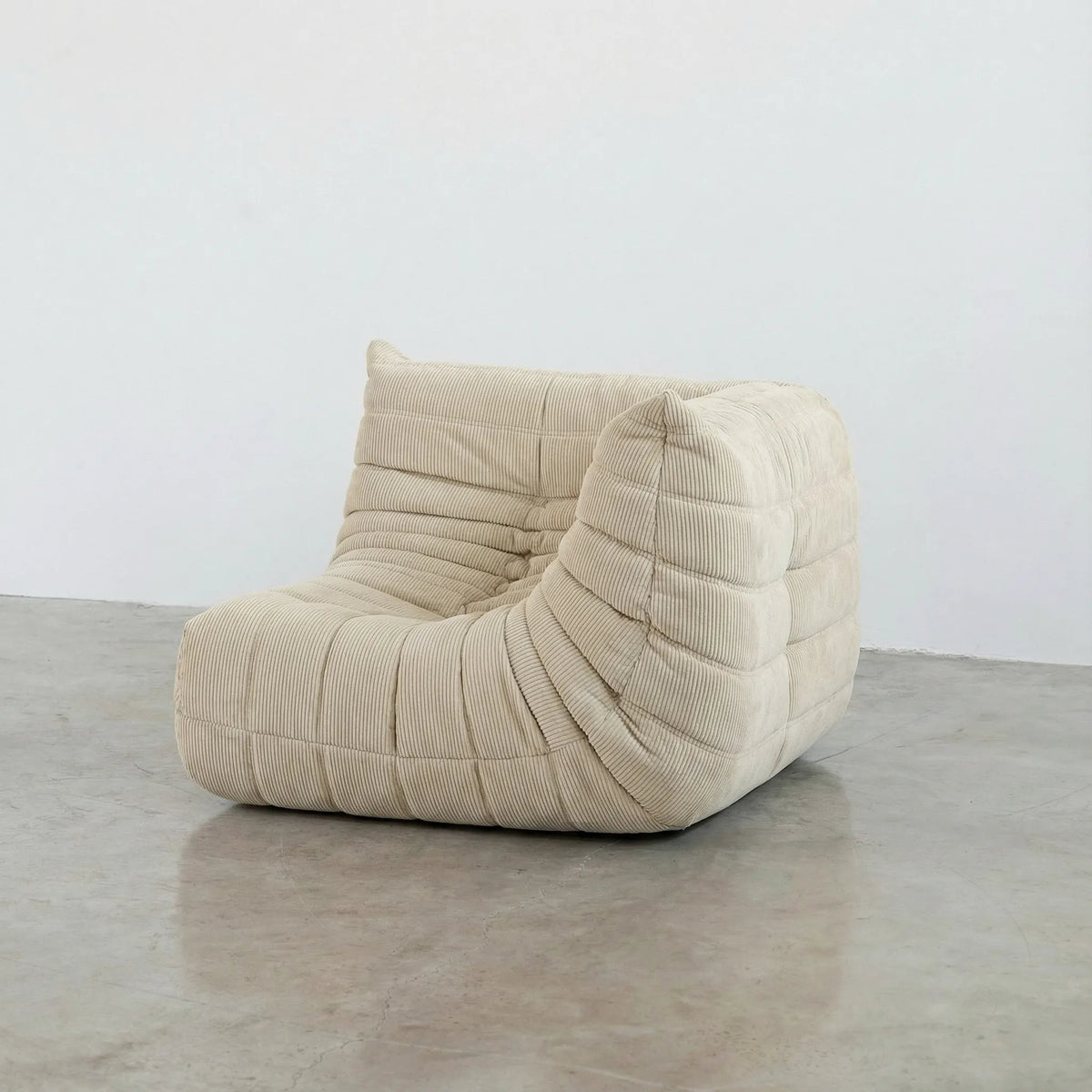 Bruma Sofa Corner in cream corduroy photographed from the front angle.