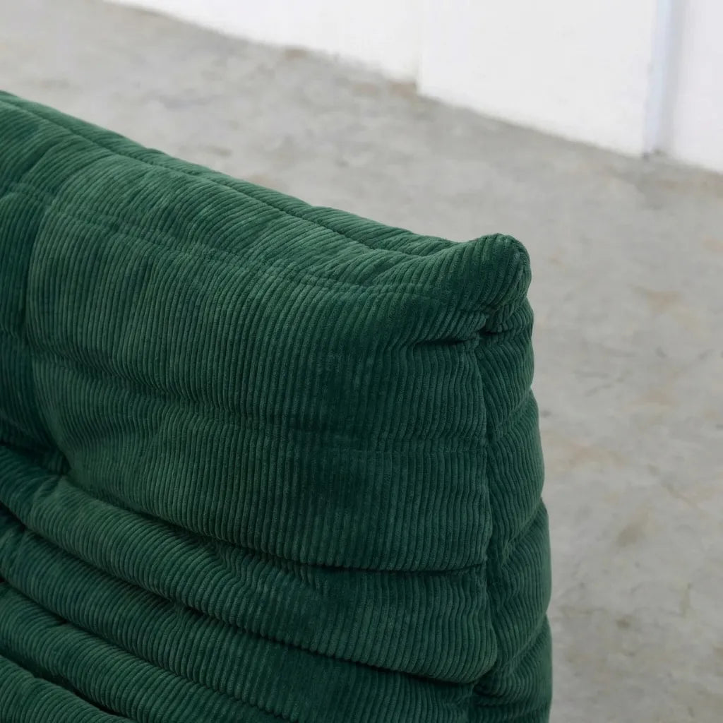 Close up of the Bruma Sofa Corner in green corduroy