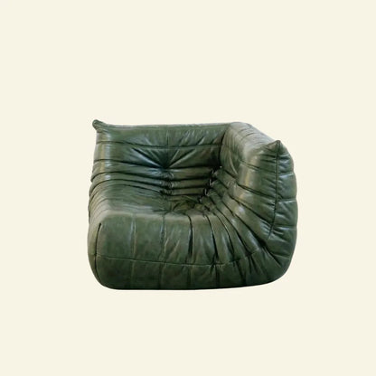 Green leather Bruma armchair on a beige background