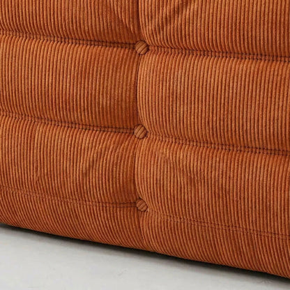 Close-up of a orange corduroy fabric texture of the Bruma sofa by vibehaus