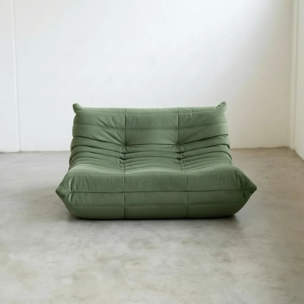 Matcha-green velvet Bruma 2-seater sofa – low, frameless design with plush channel tufting