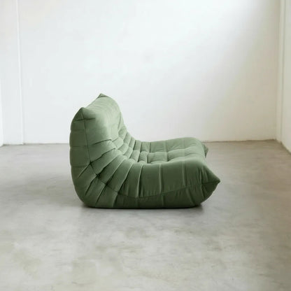 Matcha-green velvet Bruma 2-seater sofa for modern living rooms.