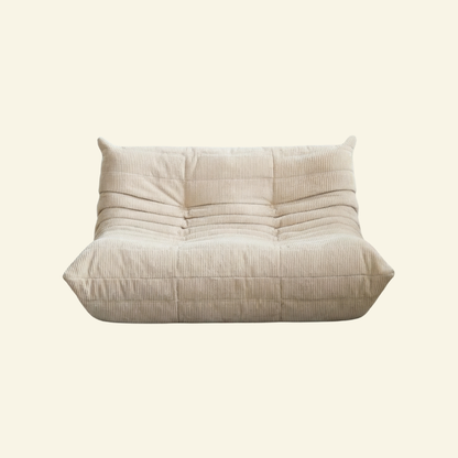 Bruma 2-seater Sofa in cream corduroy with Bruma silhouette – custom-made by vibehaus
