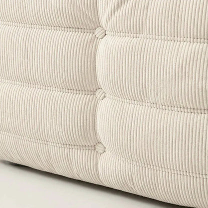 Close up of the Bruma 2-seater Sofa in cream corduroy with Bruma silhouette – custom-made by vibehaus