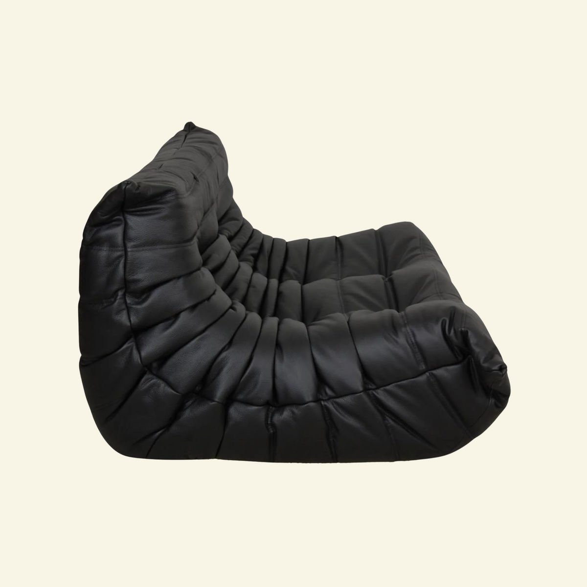 Bruma black leather 2-seater on beige background - loveseat