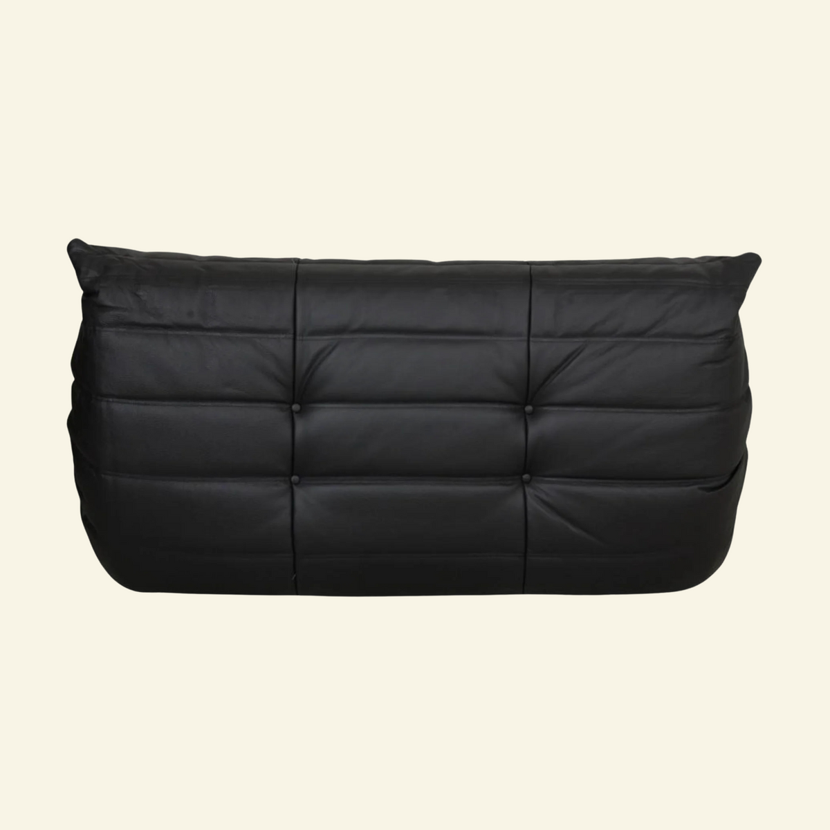 Bruma black leather 2-seater on beige backgorund