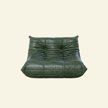 Green Bruma sofa in leather on a light beige background