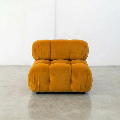 Mustard camaleonda dupe armchair on a gray floor with white walls