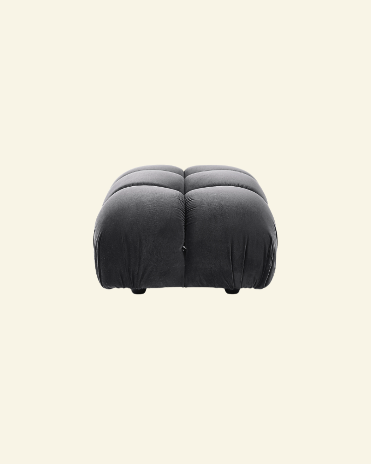 Camaleonda ottoman in black velvet replica with button-tufted detailing, shown in a high-resolution studio setting on a beige background.