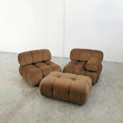 brown camaleonda ottoman and armchairs alternative on a concrete floor with white walls