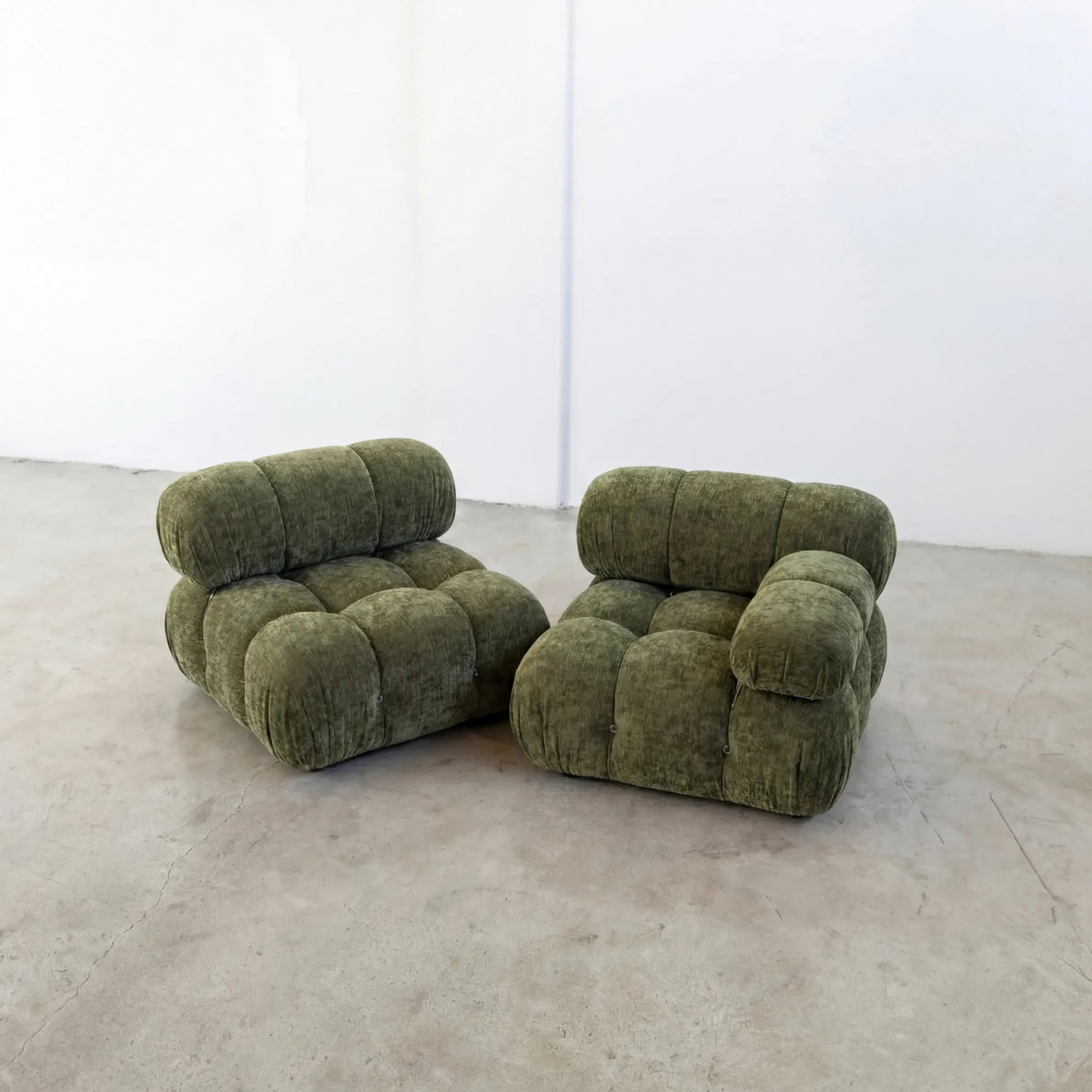 Camaleonda Sofa dupe Section (armless) and Sofa Section with left armrest in green chenille, modular sofa pieces styled on a concrete floor with white walls by vibehaus