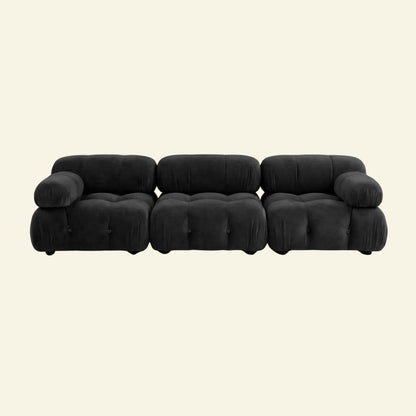Camaleonda 3 seater modular sofa dupe in dark grey velvet with tufted upholstery on a beige background