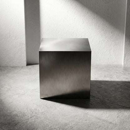 Front view of the Chrome Steel Cube Table styled as a minimalist end table with industrial modern appeal.