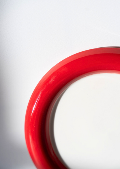 Close-up of the Two-Tone Chunky Ceramic Plate in red and white  a white background