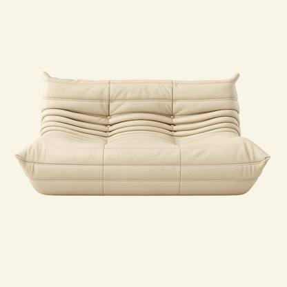 Cream colored leather 2-seater dupe on a beige background