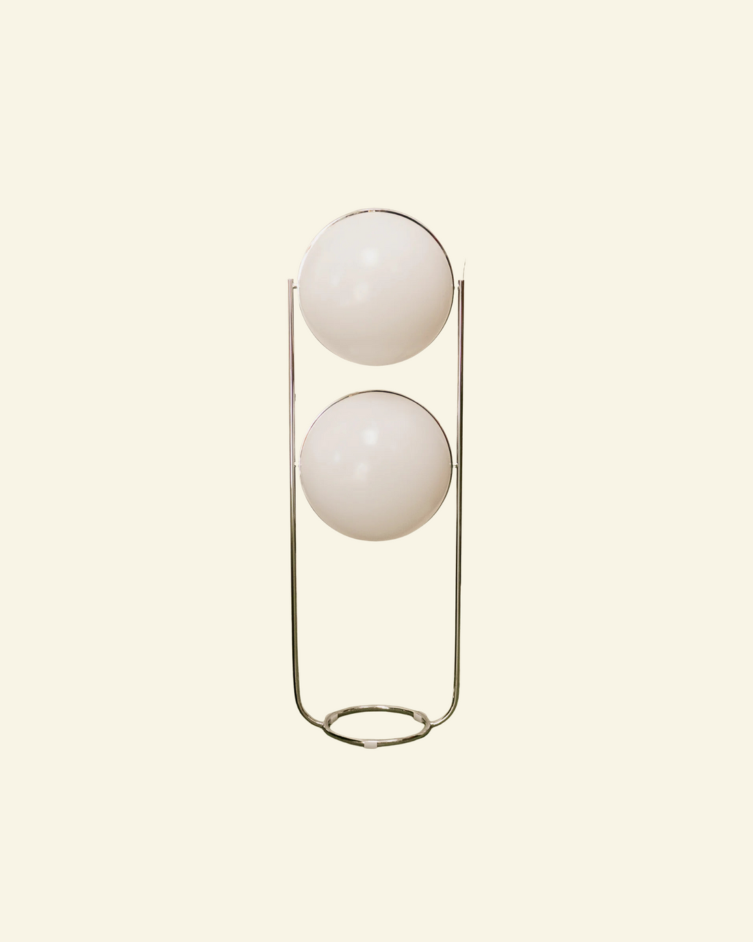 Modern floor lamp with two spherical globe white lights on a beige background