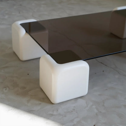 Elio Low Glass Coffee Table, a square glass coffee table with a low profile for modern lounge spaces, angled view
