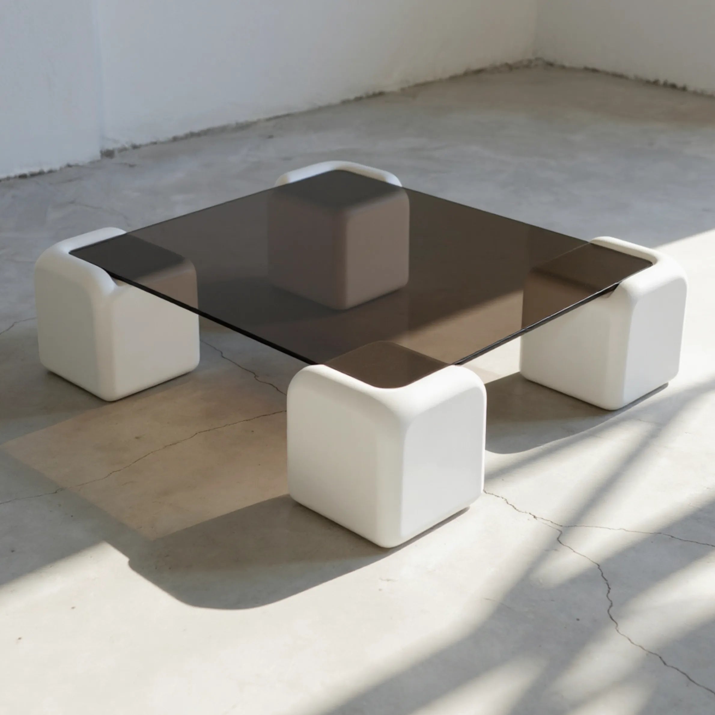 Elio Low Glass Coffee Table, a square glass coffee table with a low profile for modern lounge spaces, detail view