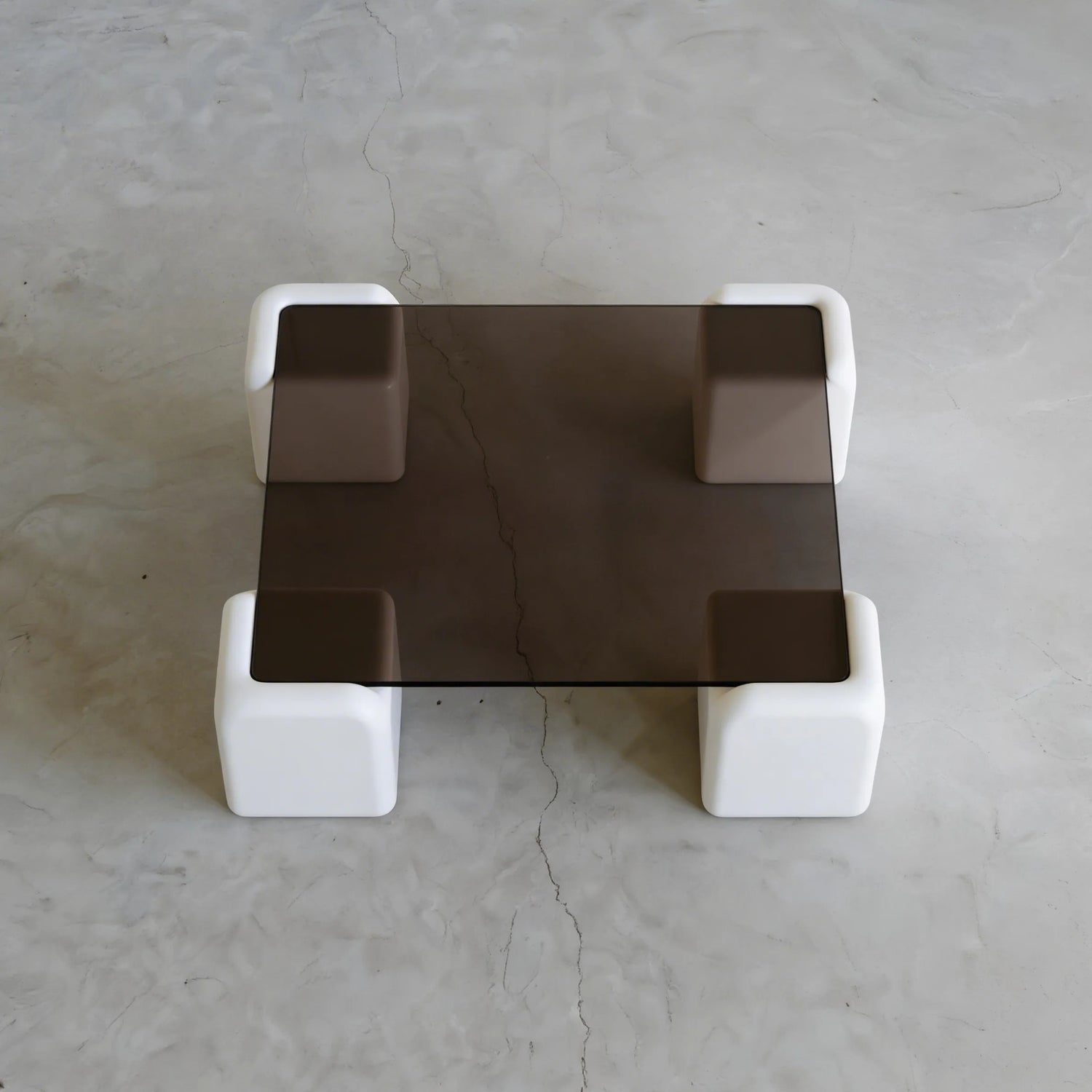 Elio Low Glass Coffee Table, a square glass coffee table with a low profile for modern lounge spaces, styled view