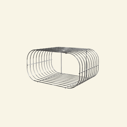 Close-up angled view of floating chrome wire wall shelf with shiny stainless steel finish