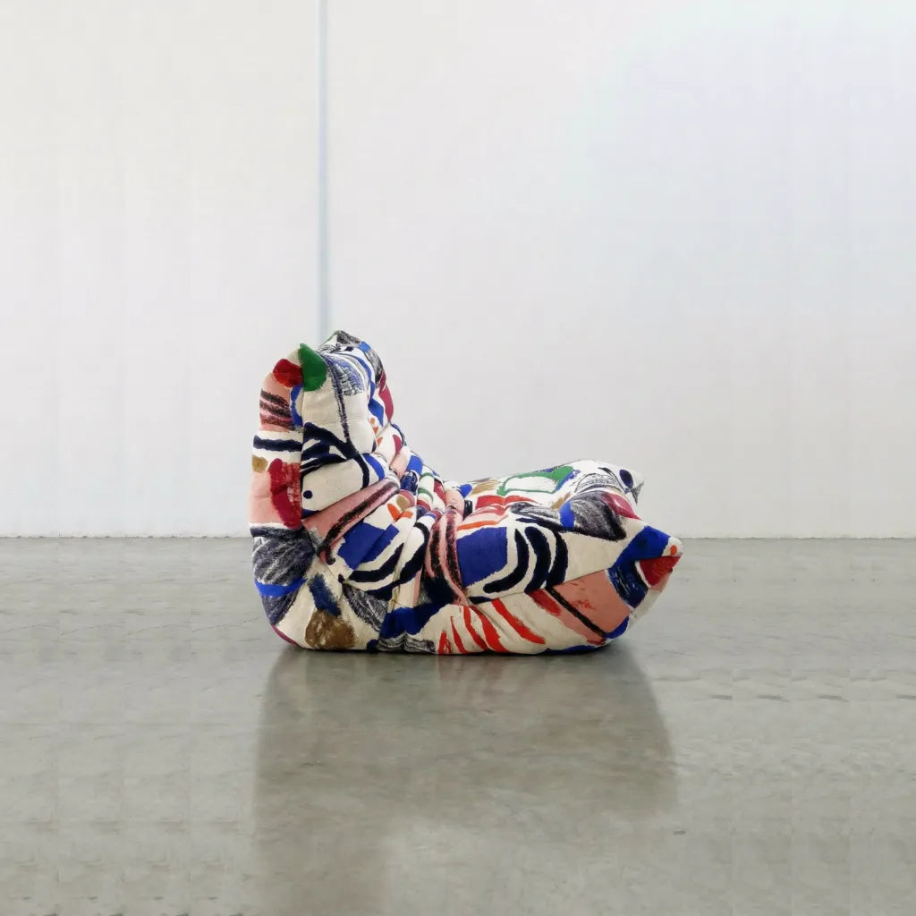 Graffiti-inspired Togo-style sofa set with velvet suede upholstery and a low, frameless caterpillar design for modern living spaces.