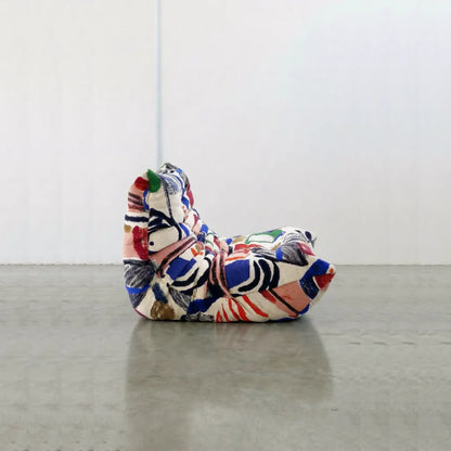 Graffiti-inspired Togo-style sofa set with velvet suede upholstery and a low, frameless caterpillar design for modern living spaces.