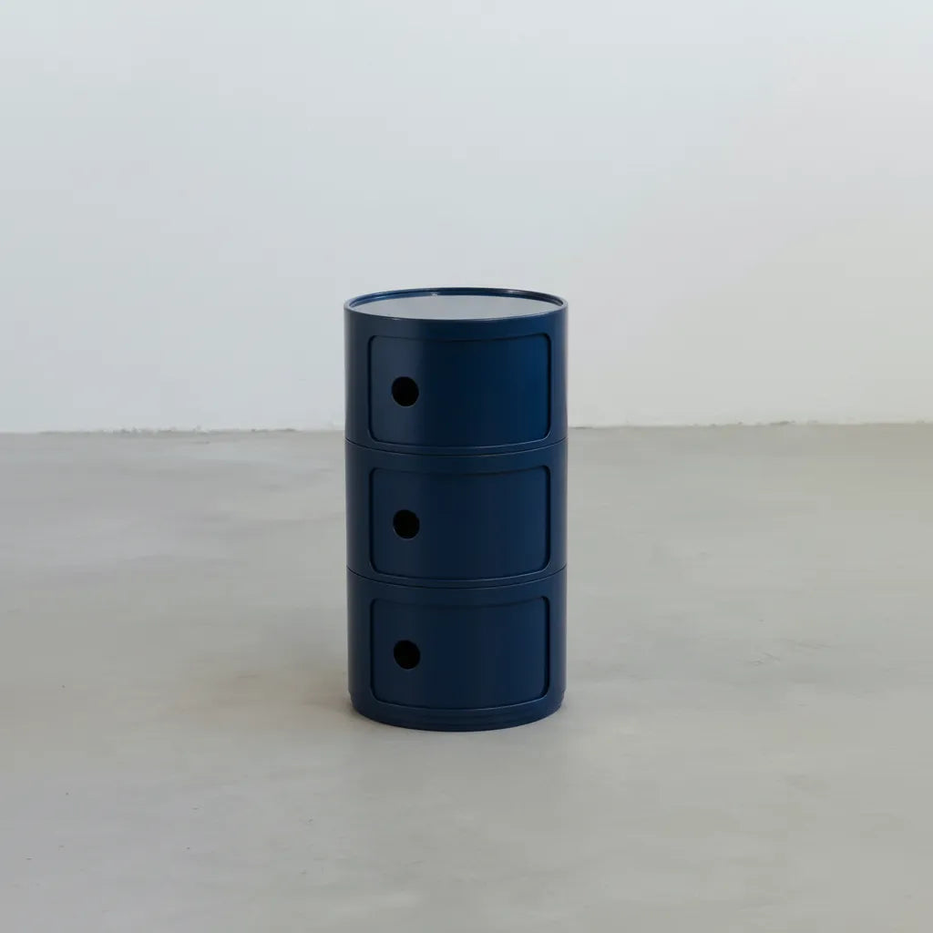 Navy Blue glossy round modular storage unit, Kartell Componibili dupe with three tiers in minimalist concrete studio