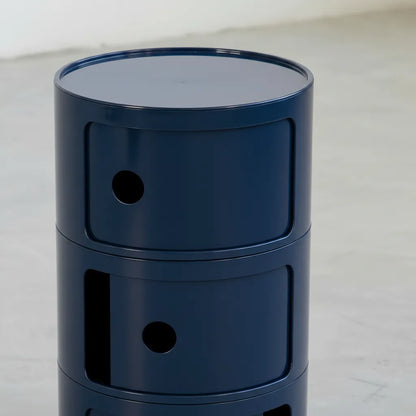 Navy Blue glossy round modular storage unit, Kartell Componibili dupe with three tiers in minimalist concrete studio
