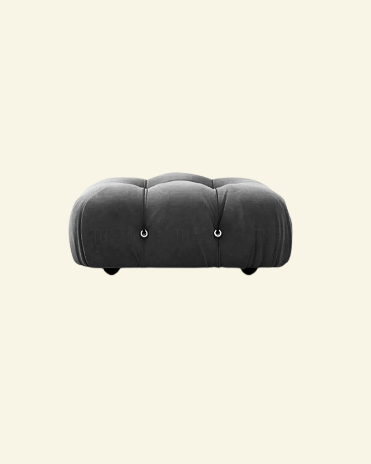 Camaleonda ottoman in black velvet replica with button-tufted detailing, shown in a high-resolution studio setting on a beige background.
