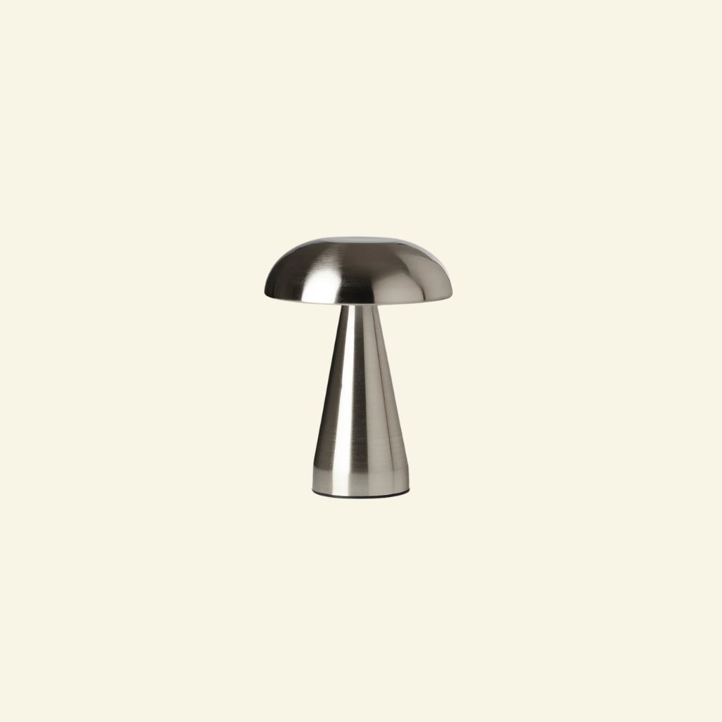 Metallic mushroom table lamp on a beige background