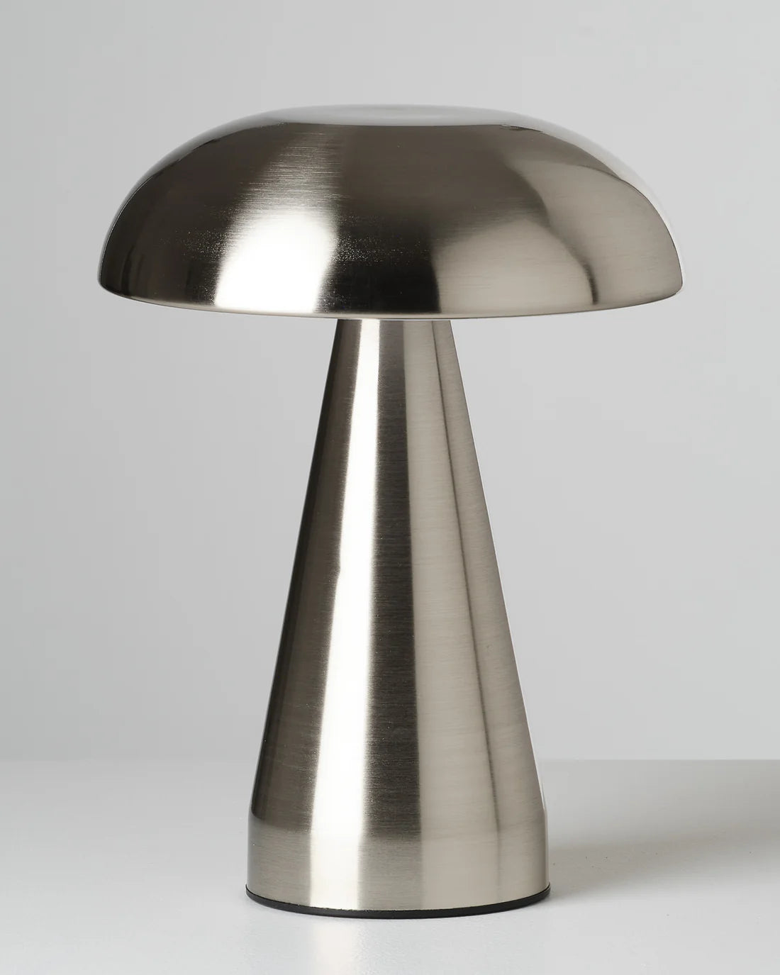 Metallic mushroom table lamp with a modern design on a white background
