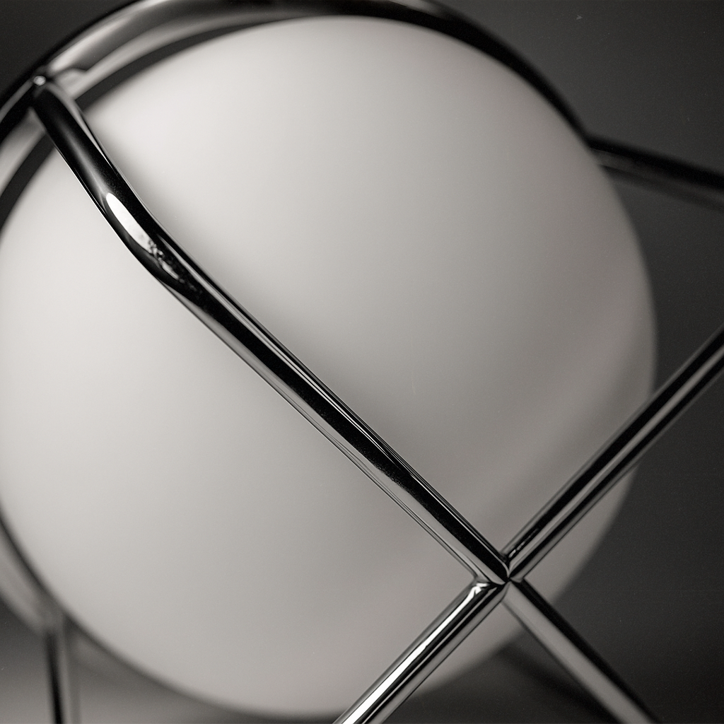 Close-up of ball table lamp base – durable iron frame and acrylic globe design.