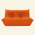 Orange leather 2-seater dupe on a beige background