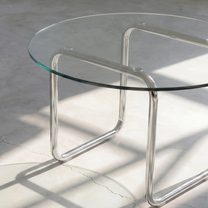 Orbit Round Glass Coffee Table, a round glass coffee table with a sculptural base for contemporary living rooms, close-up detail