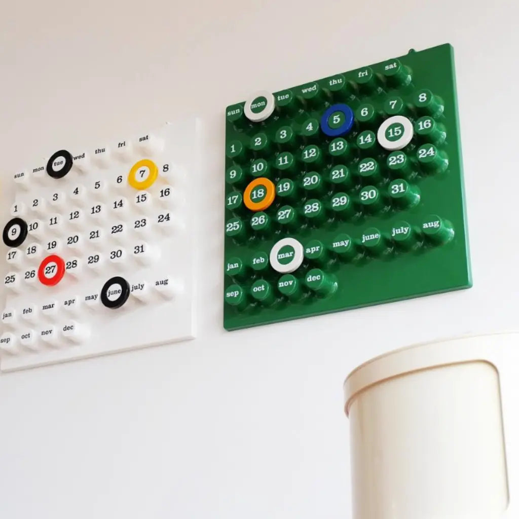 Ring a date calendar dupe white and green on the wall