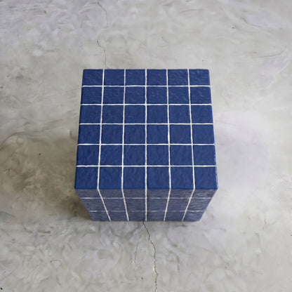 Top-down view of the blue cube side table highlighting its geometric grid pattern and glazed surface.