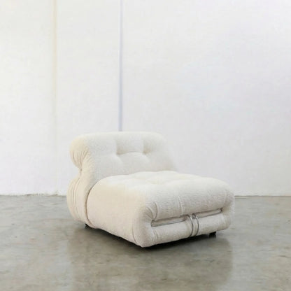 Soriana Chair Dupe in white boucle on a gray floor with a white wall background