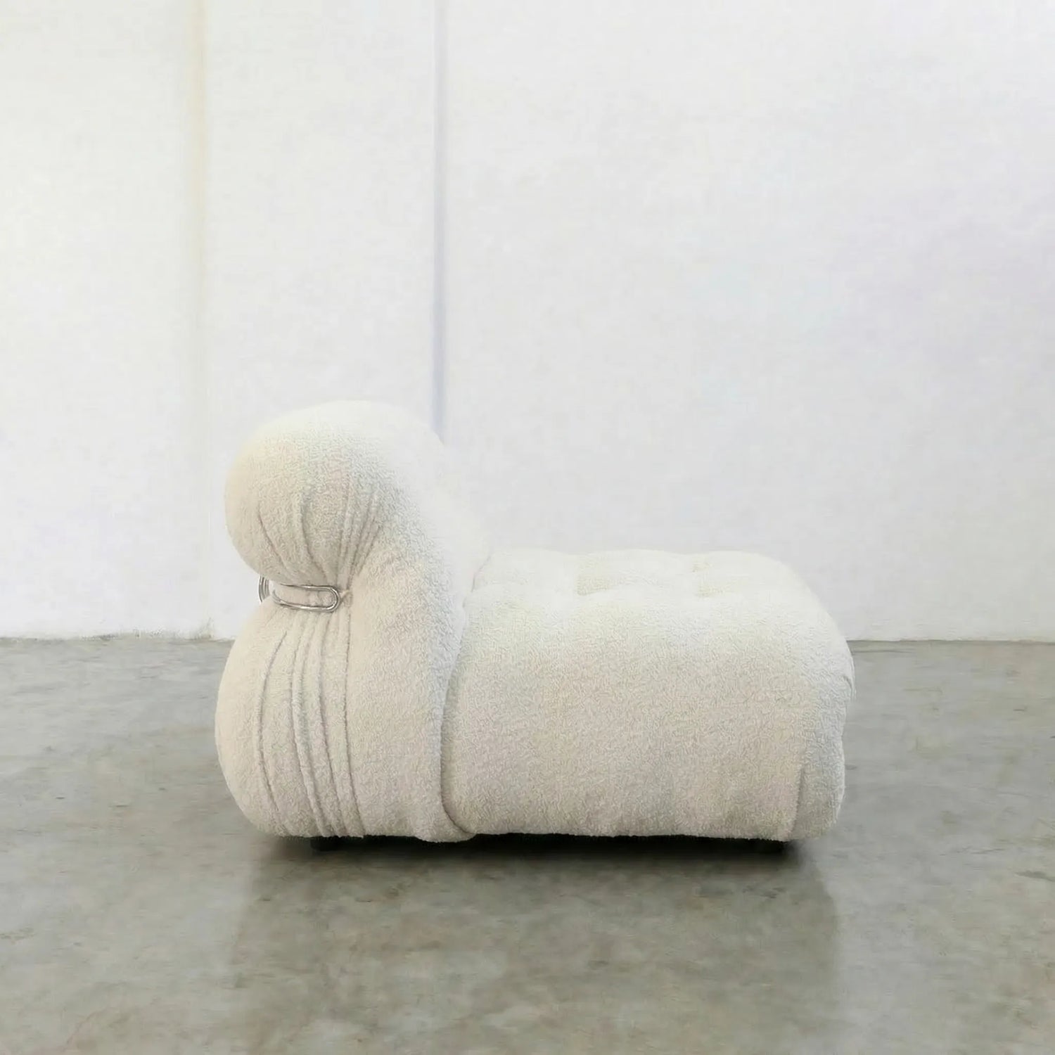 Soriana Chair Dupe in white boucle on a gray floor with a white wall background