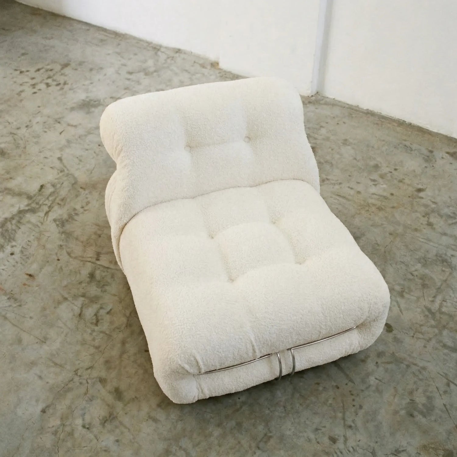 Soriana Chair Dupe in white boucle on a concrete floor