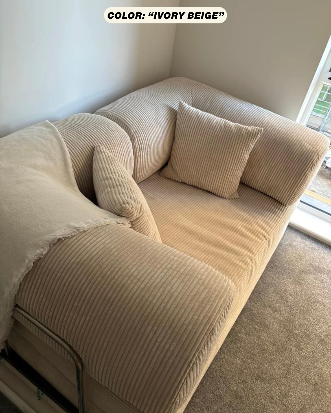 teddy modular sofa alternative in cream, ivory beige color with cushions in a room with a window and carpet.