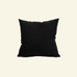 Black corduroy pillow on a beige background