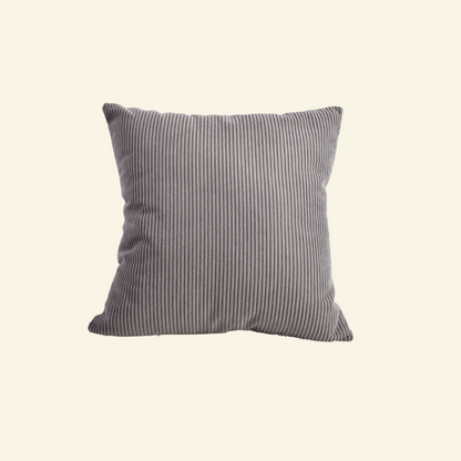 Striped  corduroy pillow on a beige background