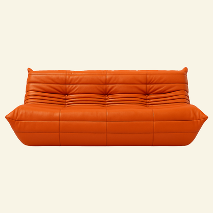 Togo-inspired 3-seater sofa replica in orange leather, full front view with deep seat and pleated folds – Vibehaus.