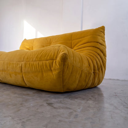 togo sofa dupe 3-seater close-up showing the yellow velvet upholstery and curved side detail by vibehaus