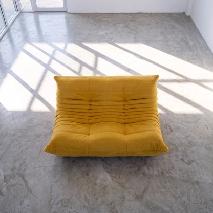 togo sofa dupe in yellow velvet viewed from above in a bright studio by vibehaus