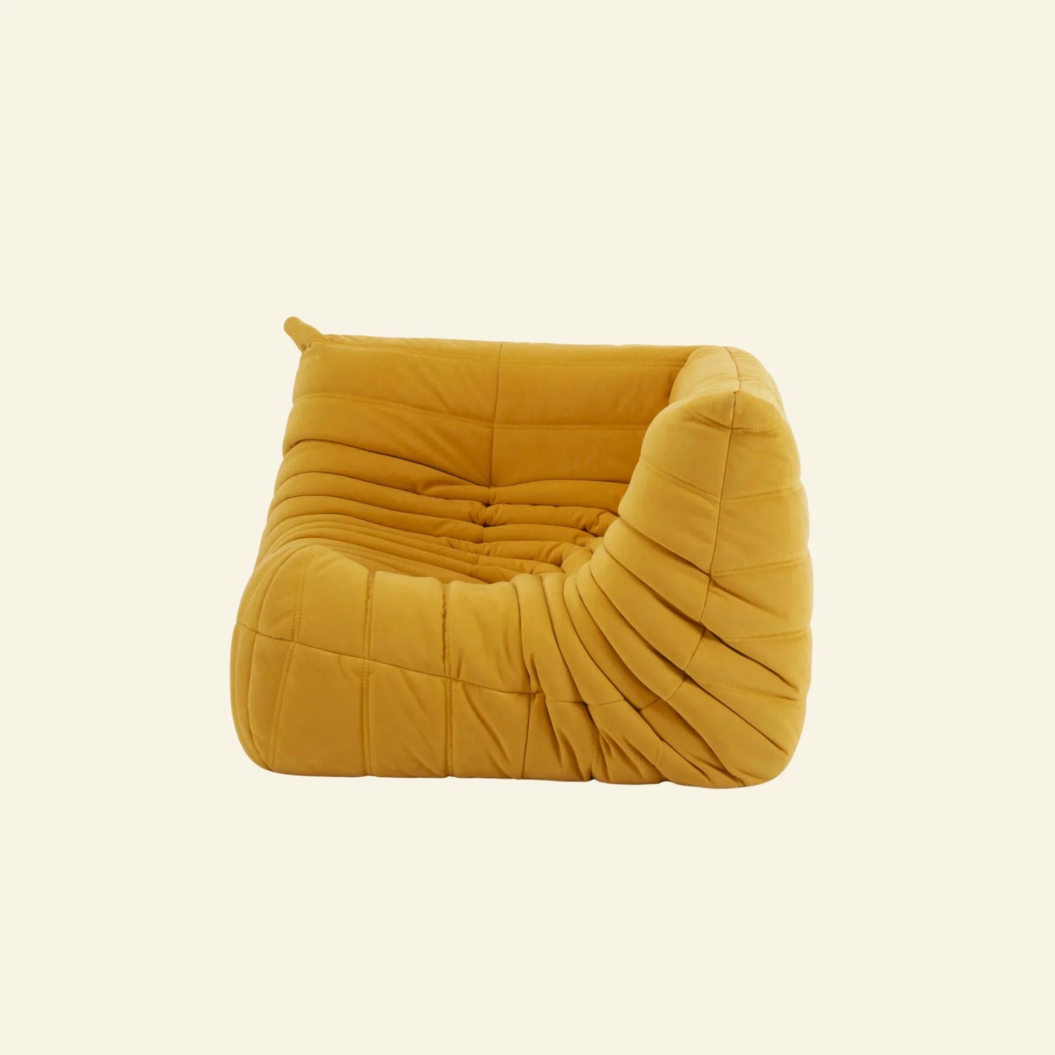 togo sofa dupe corner module in yellow velvet on a warm neutral studio background by vibehaus