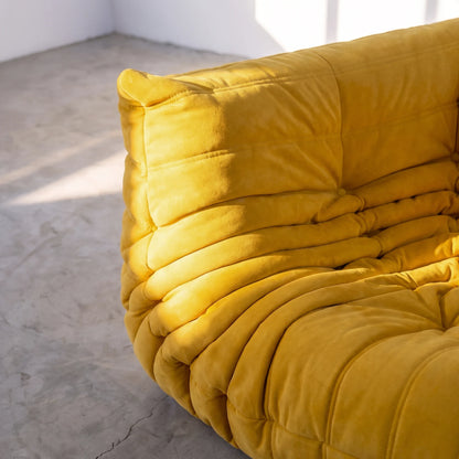 togo sofa dupe corner module close-up showing the yellow velvet upholstery and tufting by vibehaus