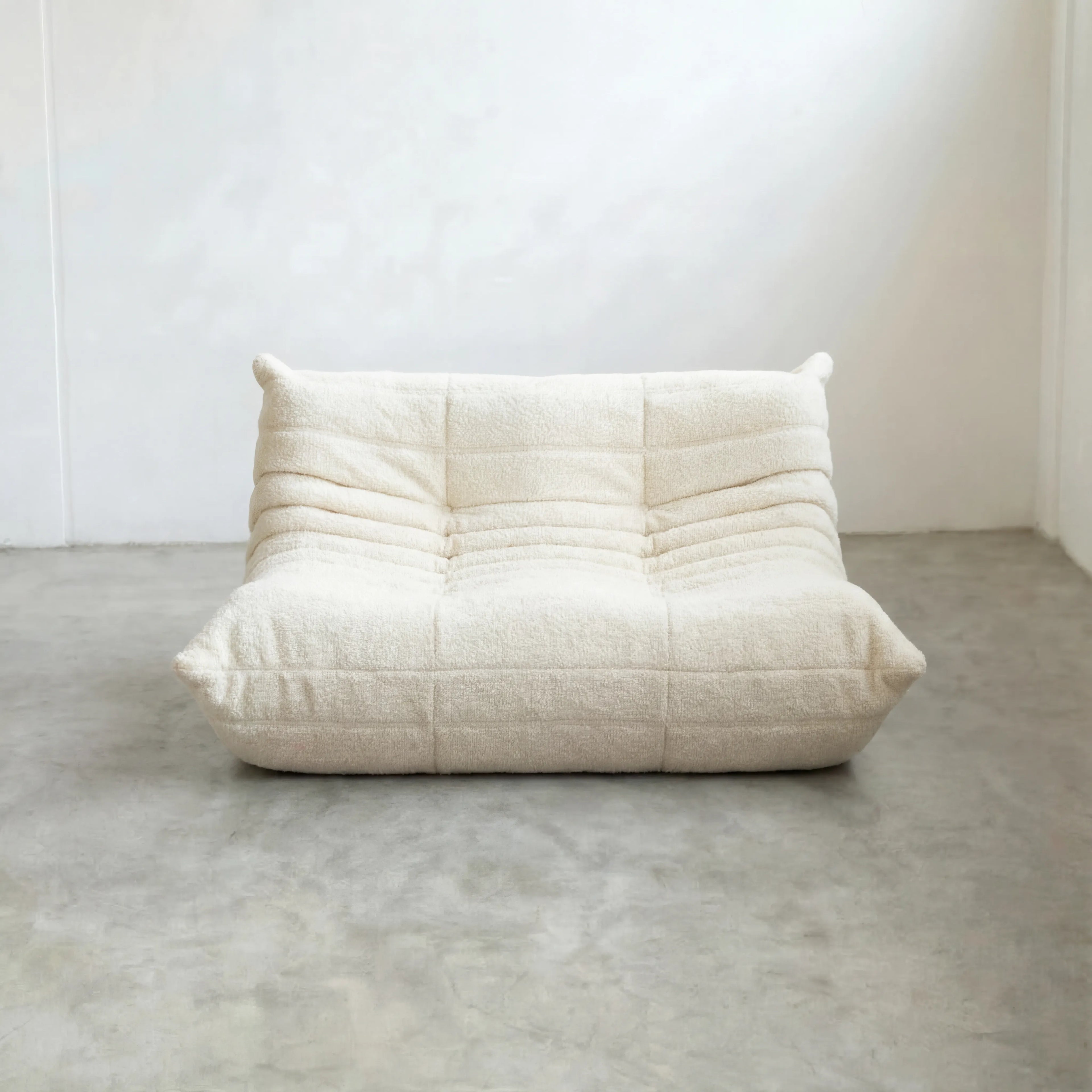 Togo 2-seater Sofa dupe in white bouclé with Togo silhouette designed by michael ducaroy for ligne roset – custom-made by vibehaus